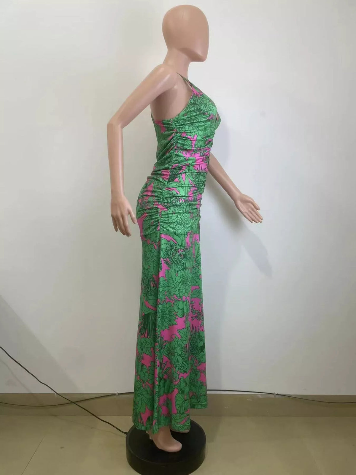 Back view of the green printed halter neck dress