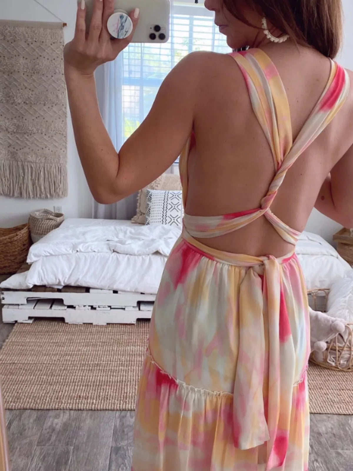 Tiered dress shown at a side angle showing the skirt tiers