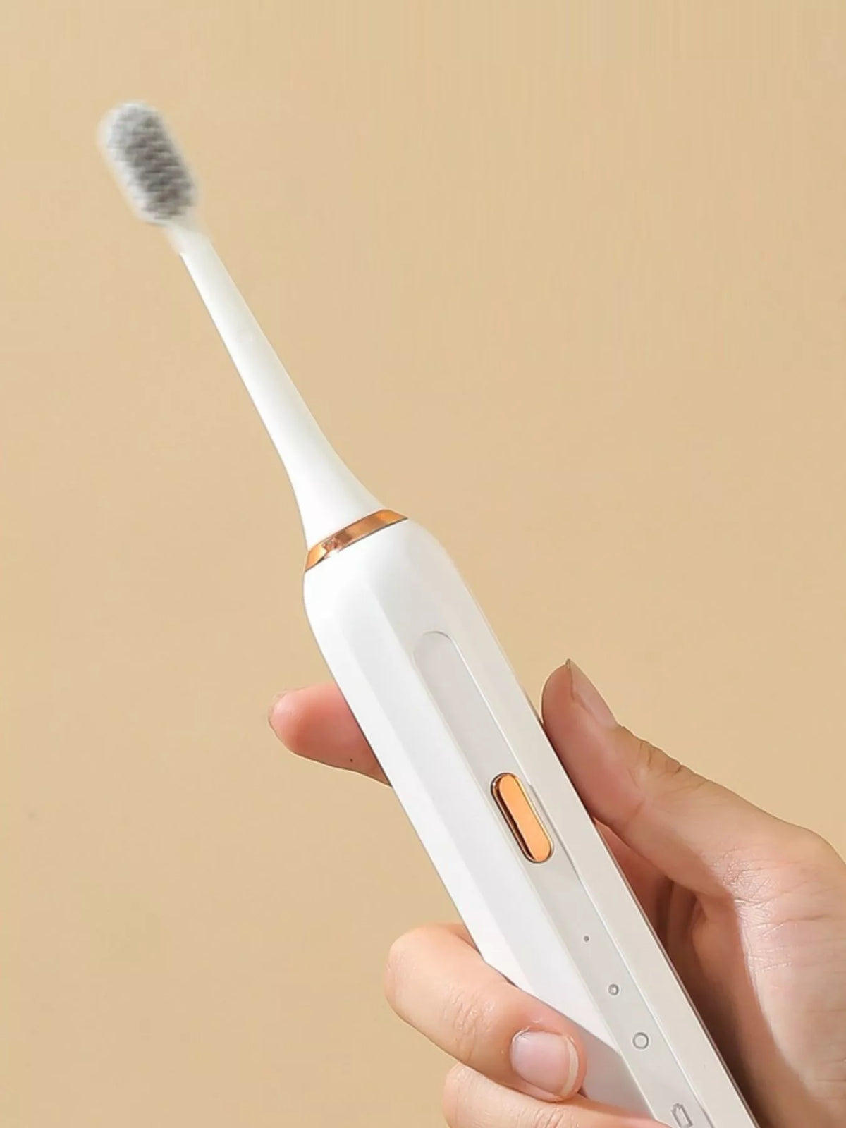 Waterproof electric toothbrush held in hand