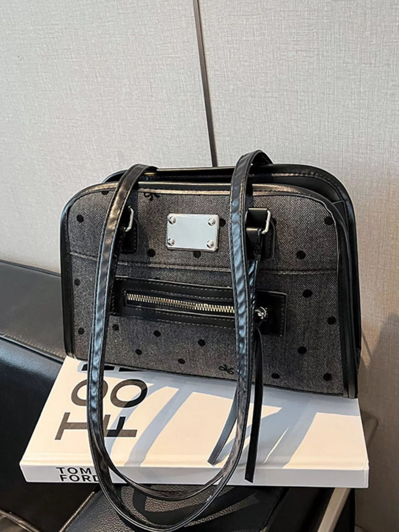 Black polka dot convertible shoulder bag front view