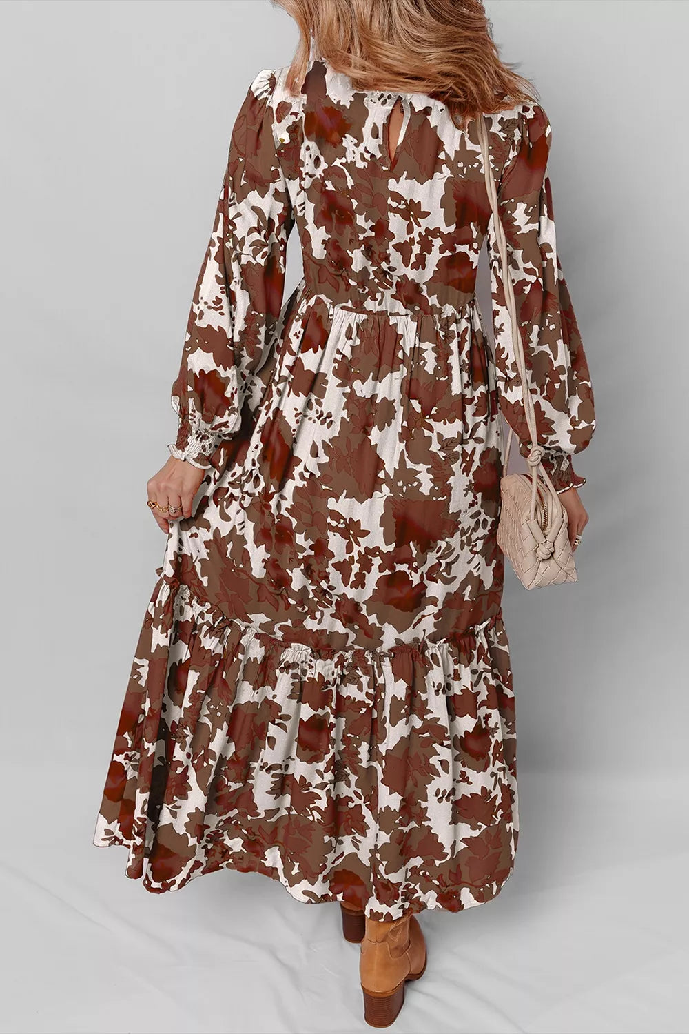 Smocked bodice and puff sleeve detail on the floral dress