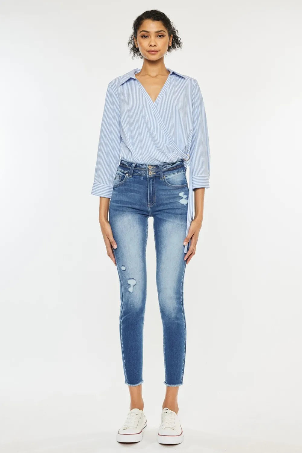 Distressed detail on medium wash skinny jeans