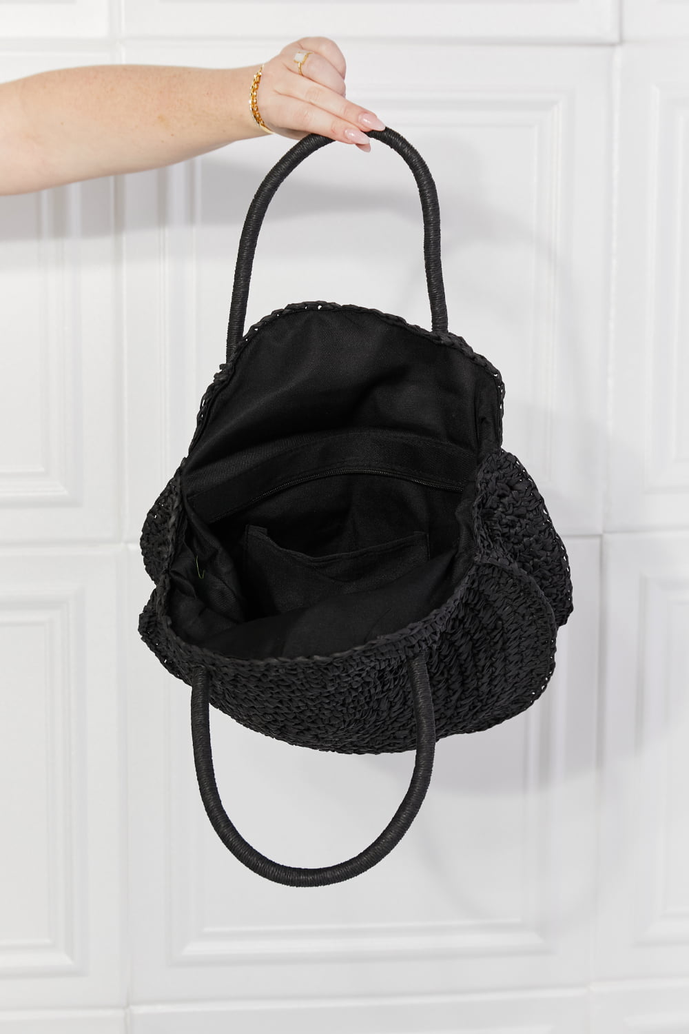 Black rattan handbag shoulder strap detail