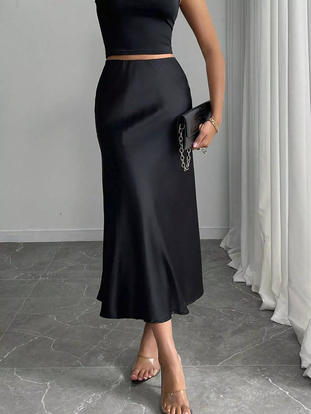 Back view of the satin midi skirt