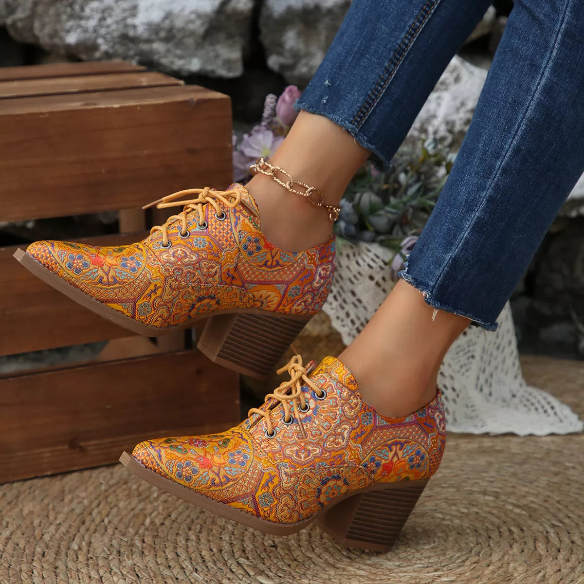 Point toe ankle boots styled with a dress
