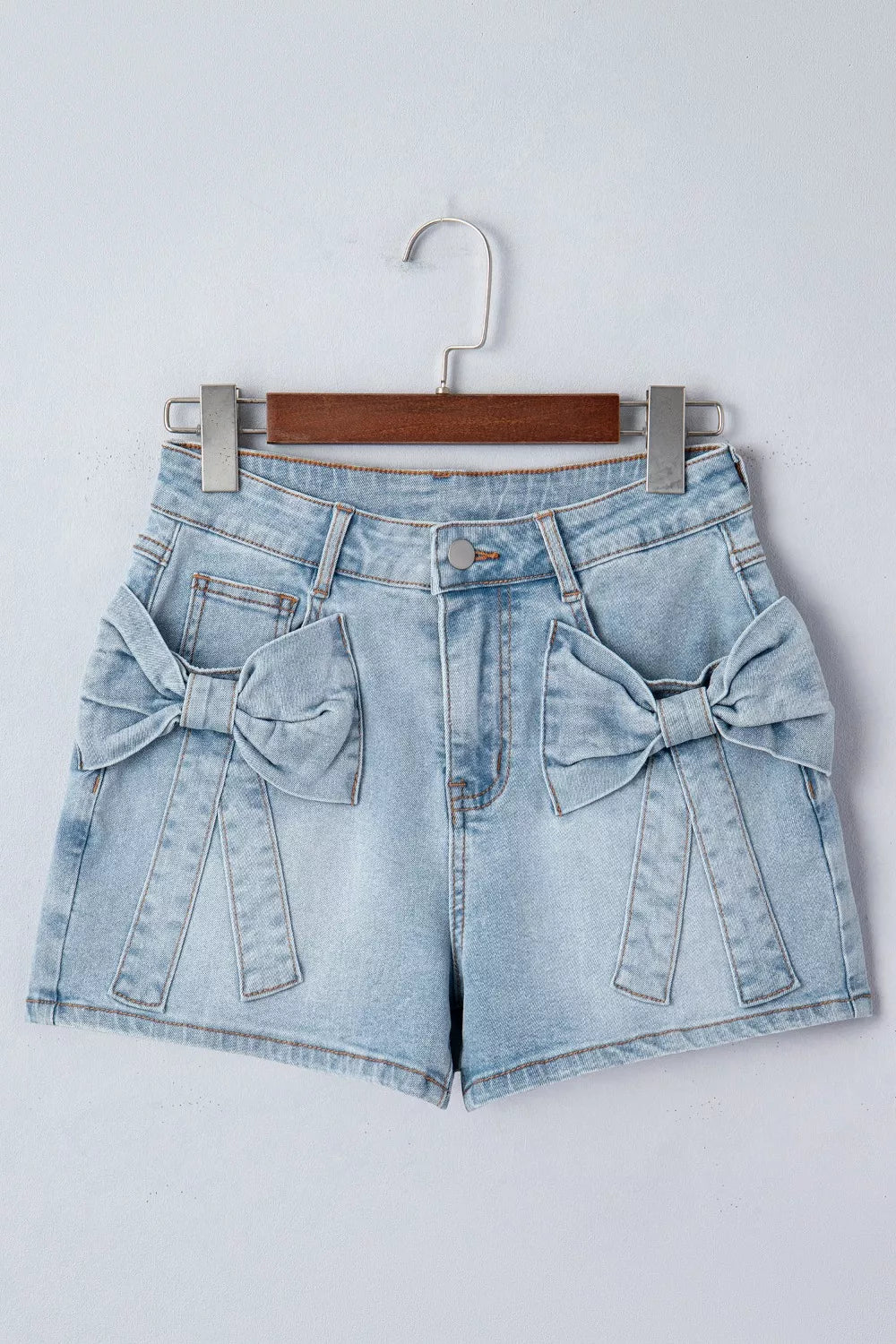 Light blue bow detail denim shorts detail view
