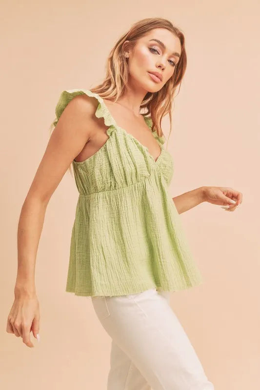 Yellow green sleeveless ruffled strap top side view