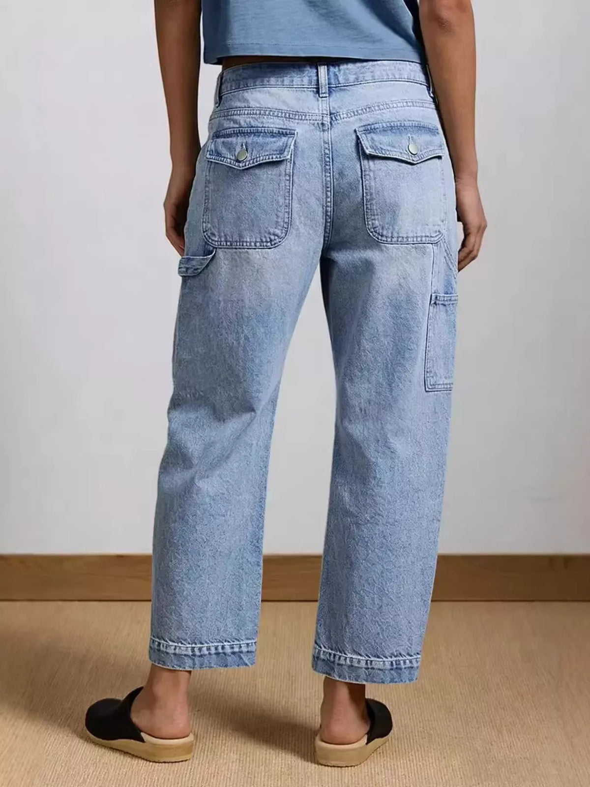 Side view of washed blue wide leg stretch jeans