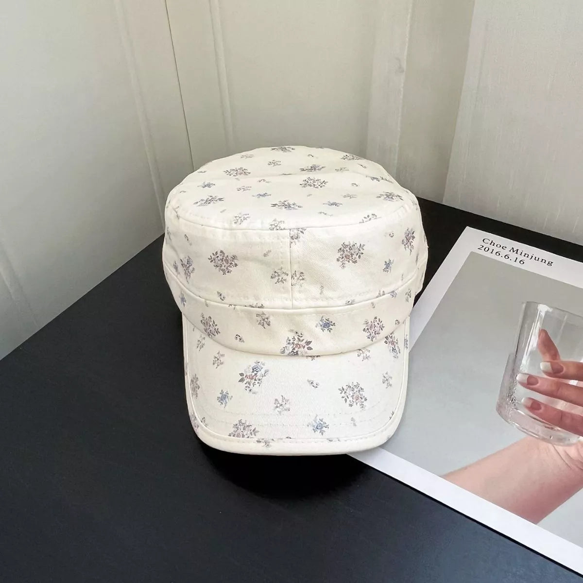 Floral print flat top hat shown from the front
