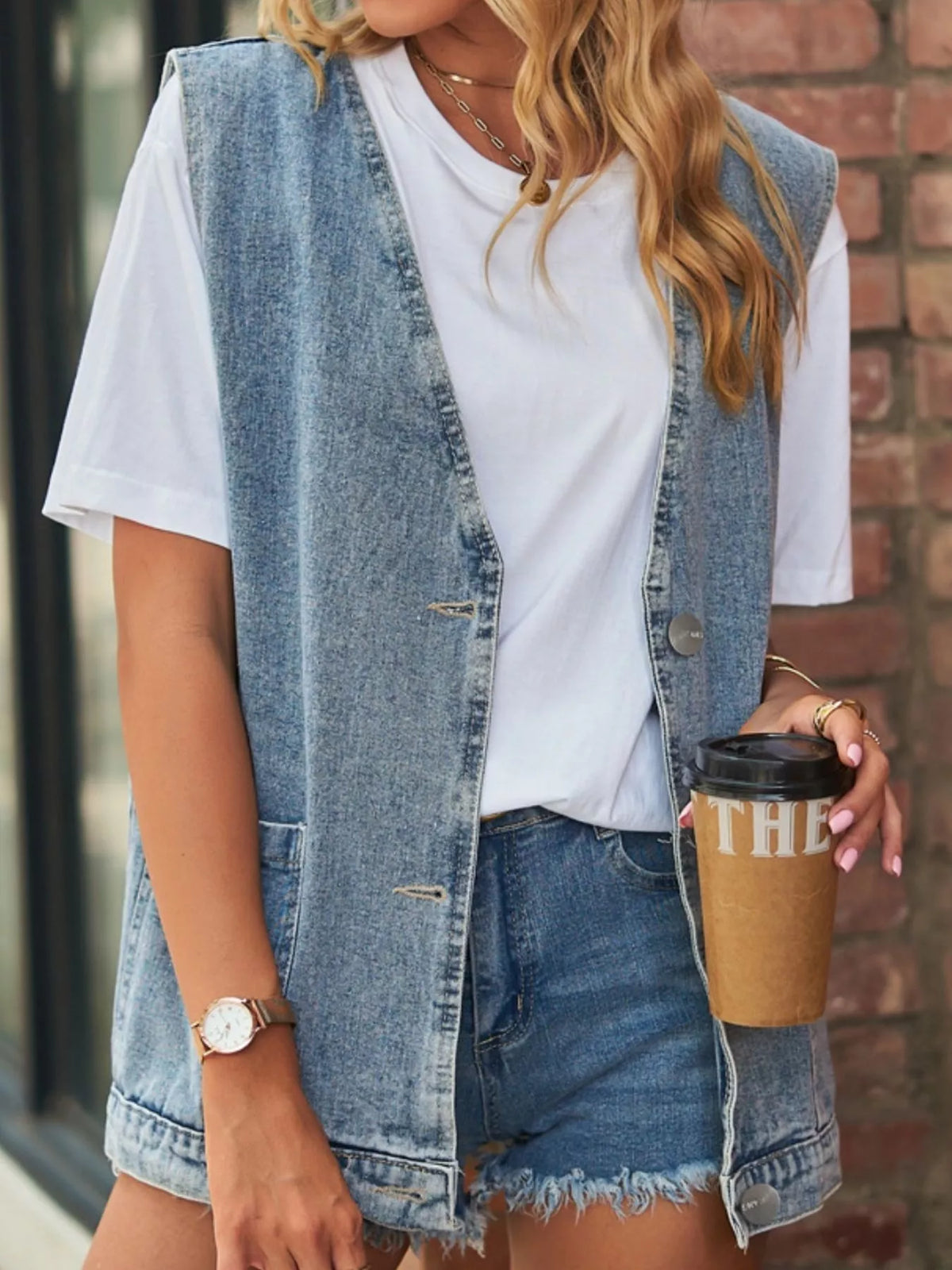 Sleeveless Button Down Denim Vest in Light Blue on model