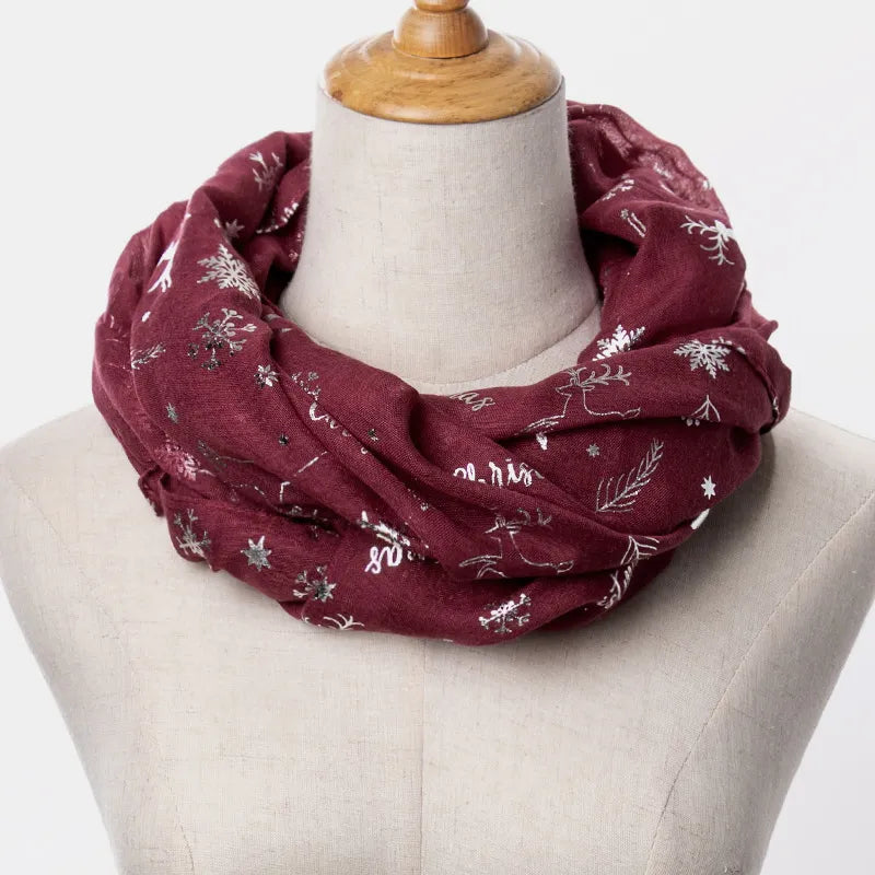 Light gray holiday scarf worn as a wide wrap