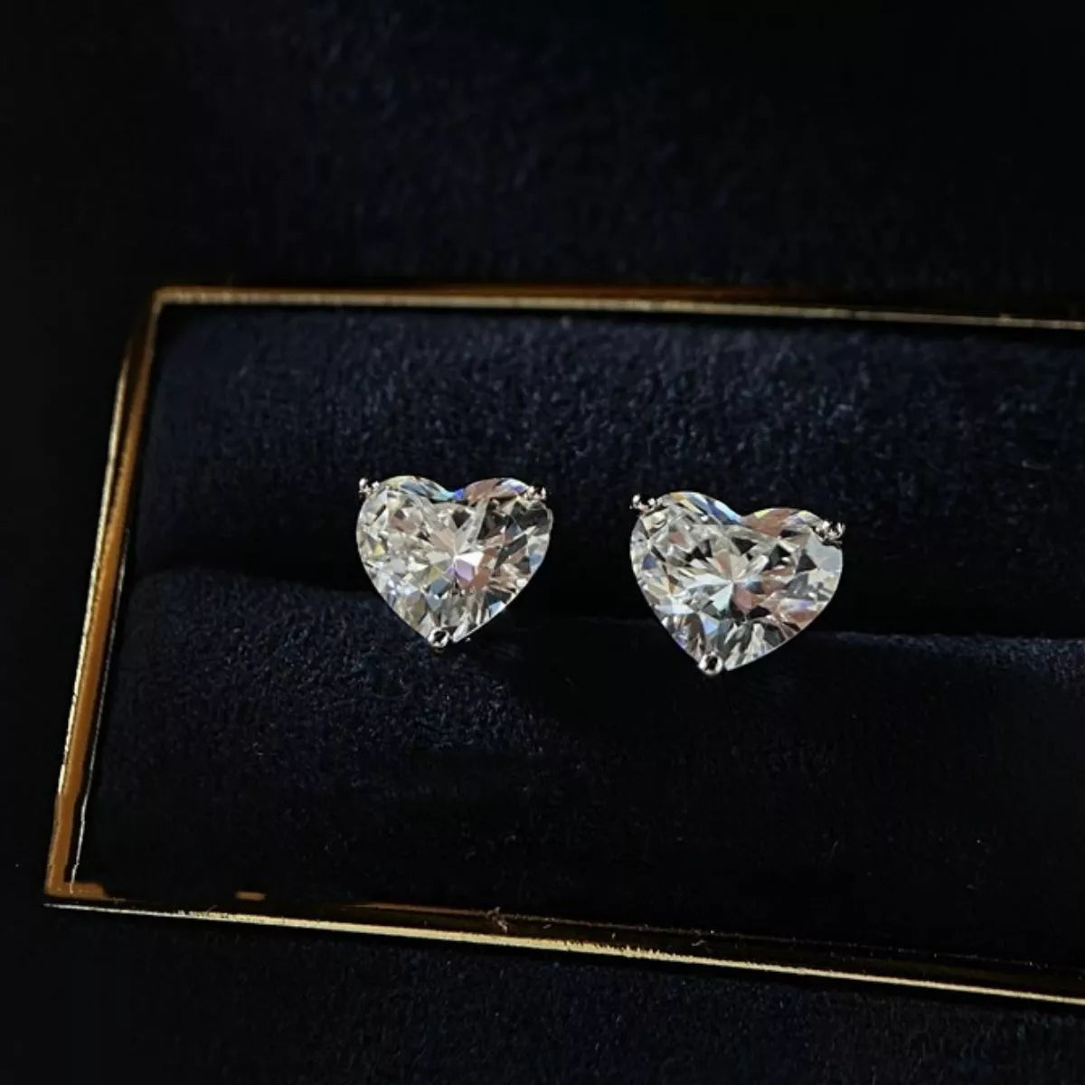 Heart earrings angled to show stone brilliance