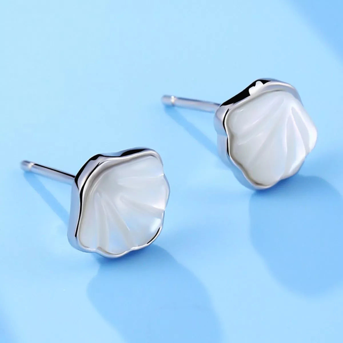 Shell stud earrings shown as a pair