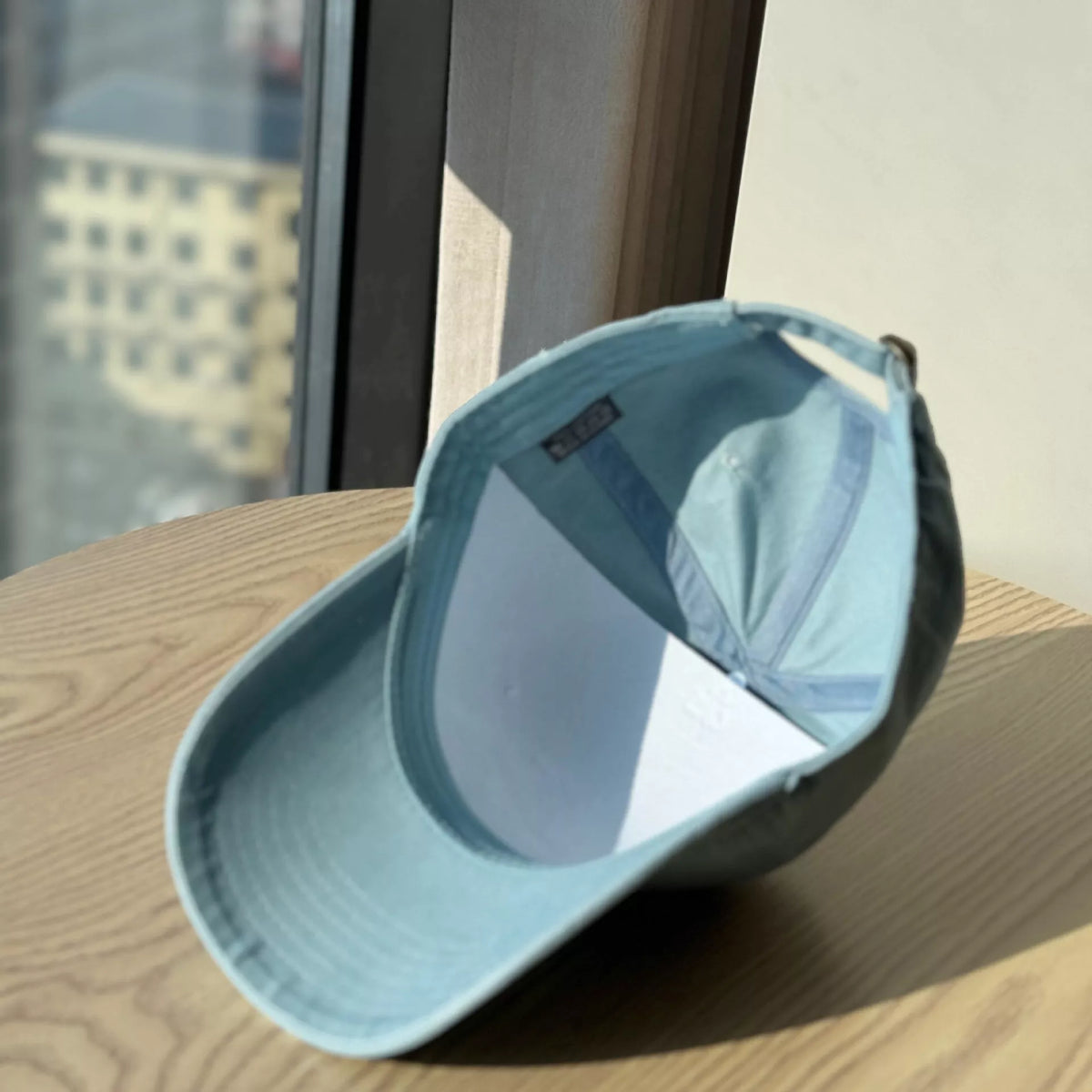 Embroidered letter cap brim detail