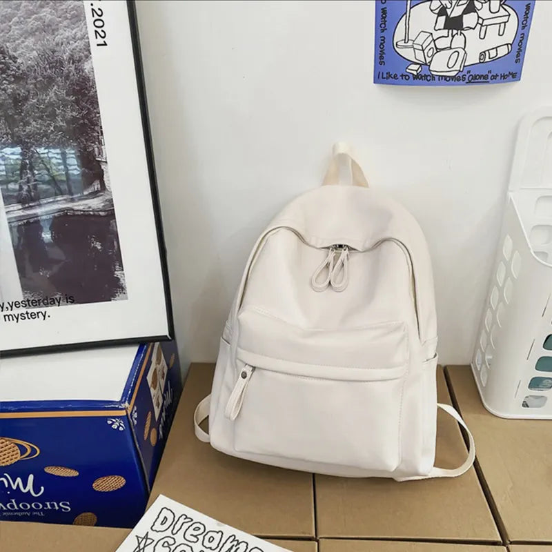 Faux leather zip backpack angled three quarter view