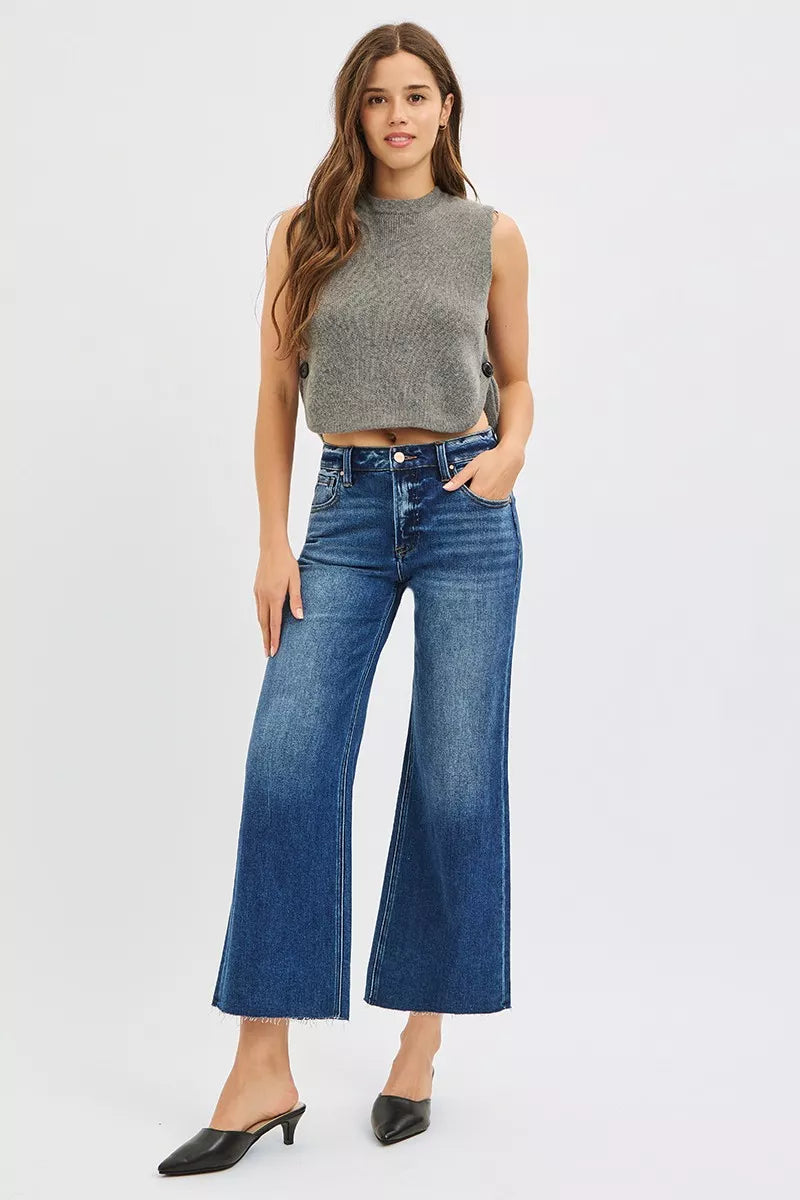 Model wearing RISEN cropped wide leg raw hem jeans styled look