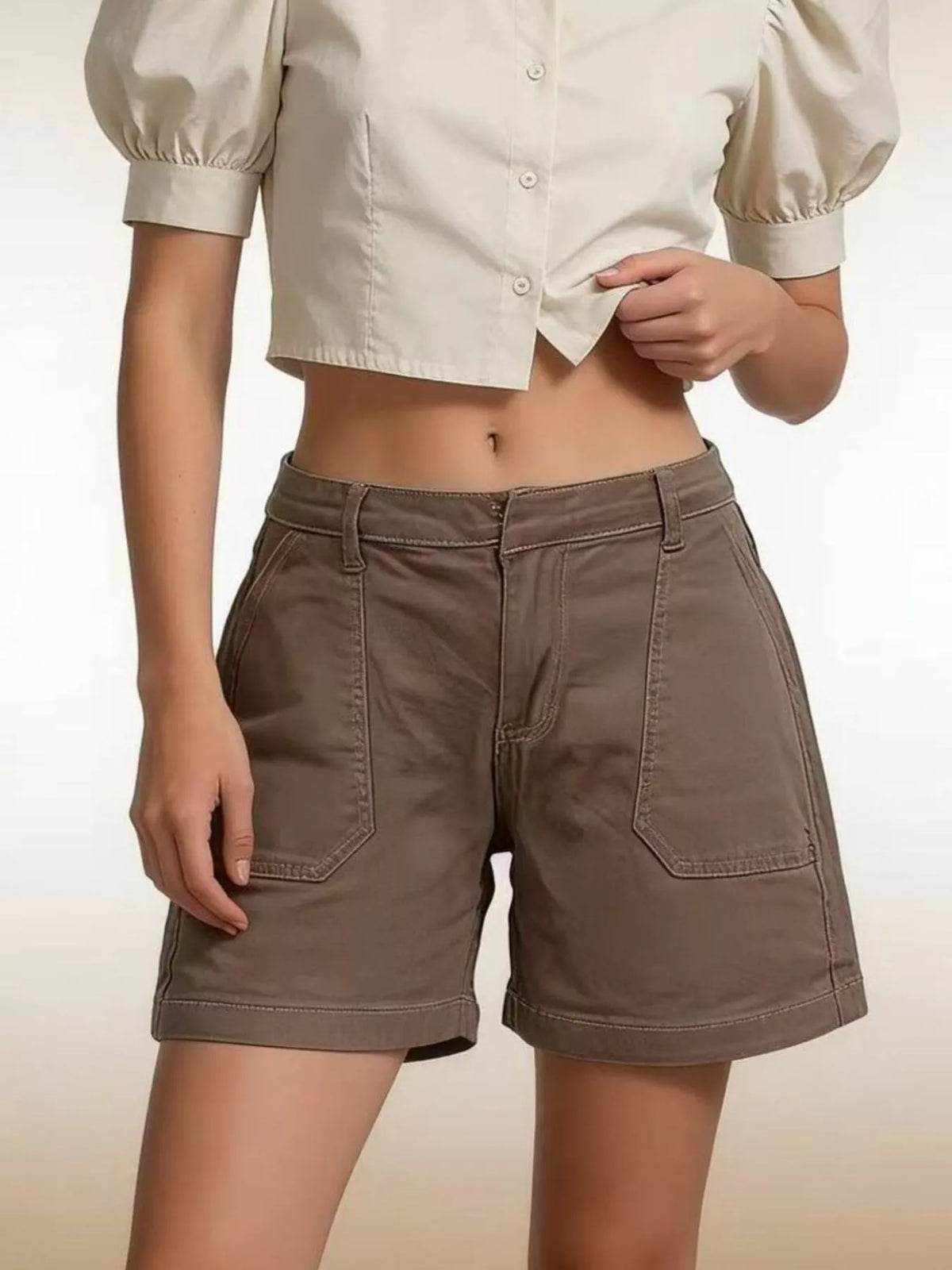 Denim shorts waistband and button closeup