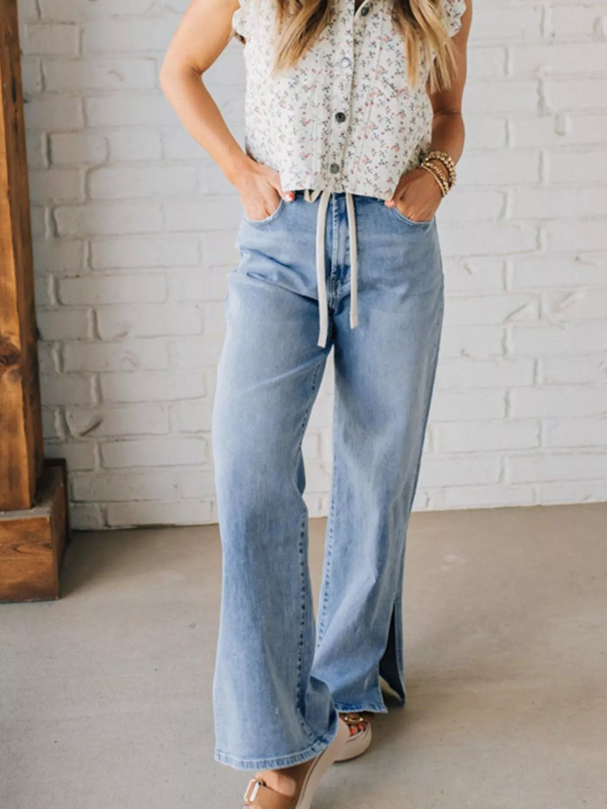 Back view of slit hem wide leg jeans