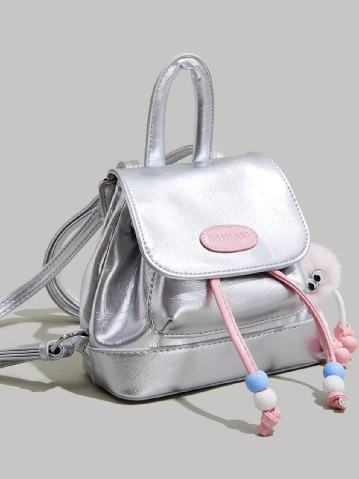 silver contrast mini backpack top handle and zip detail