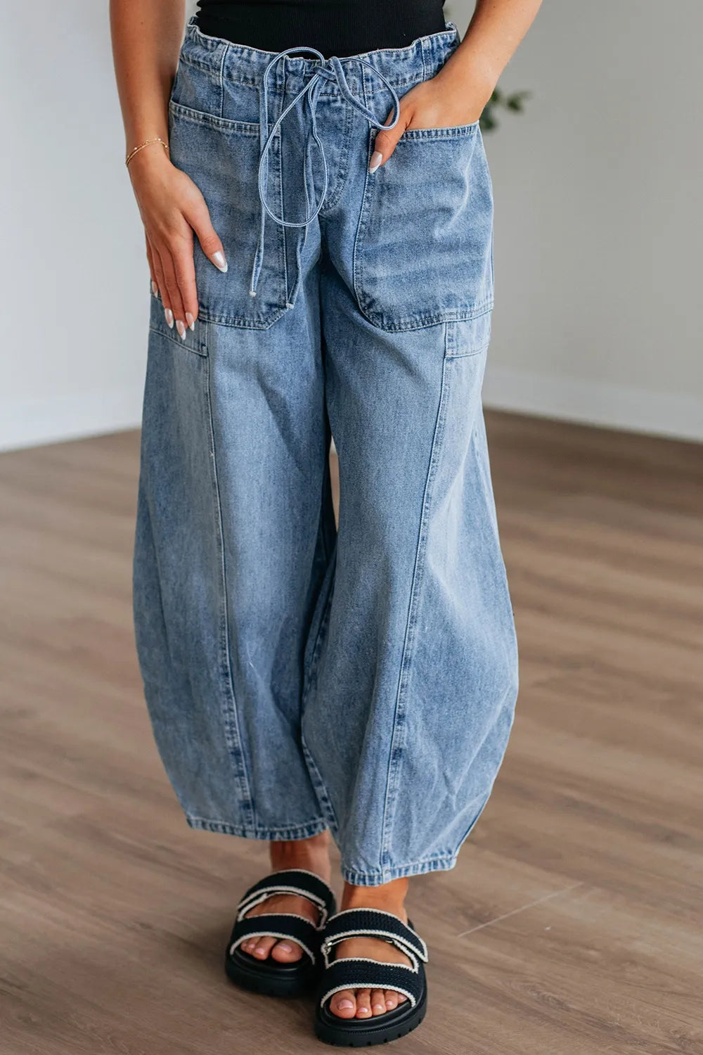Wide leg drawstring jeans in medium wash front view
