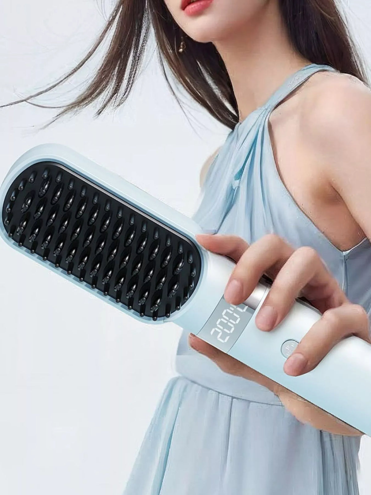 Straightening brush control button