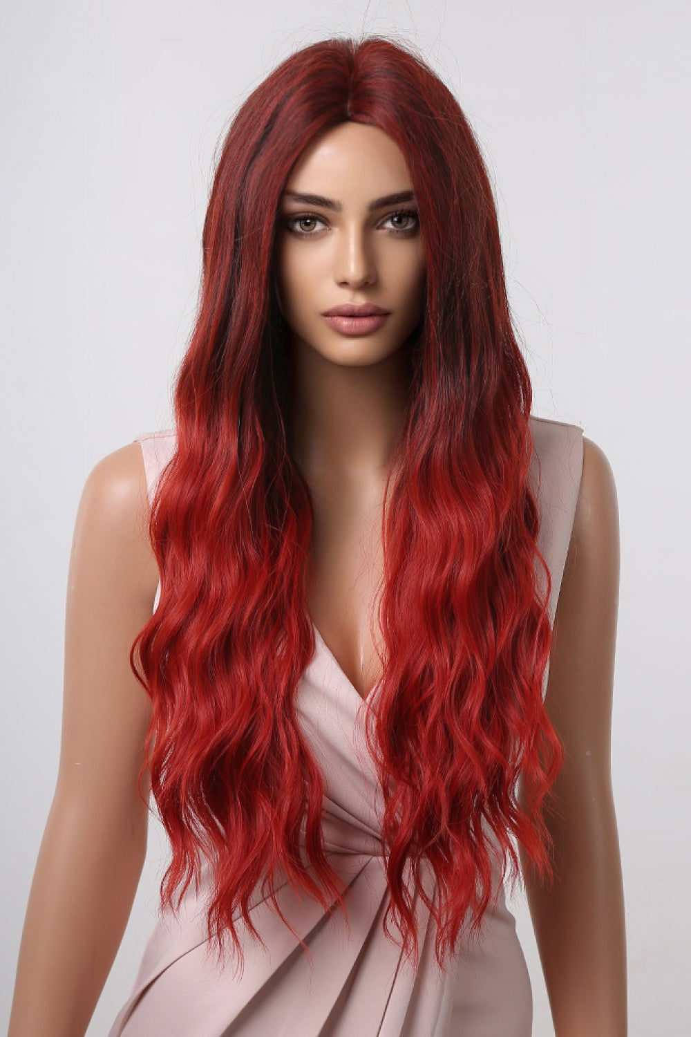 Red ombre synthetic long wave wig on mannequin