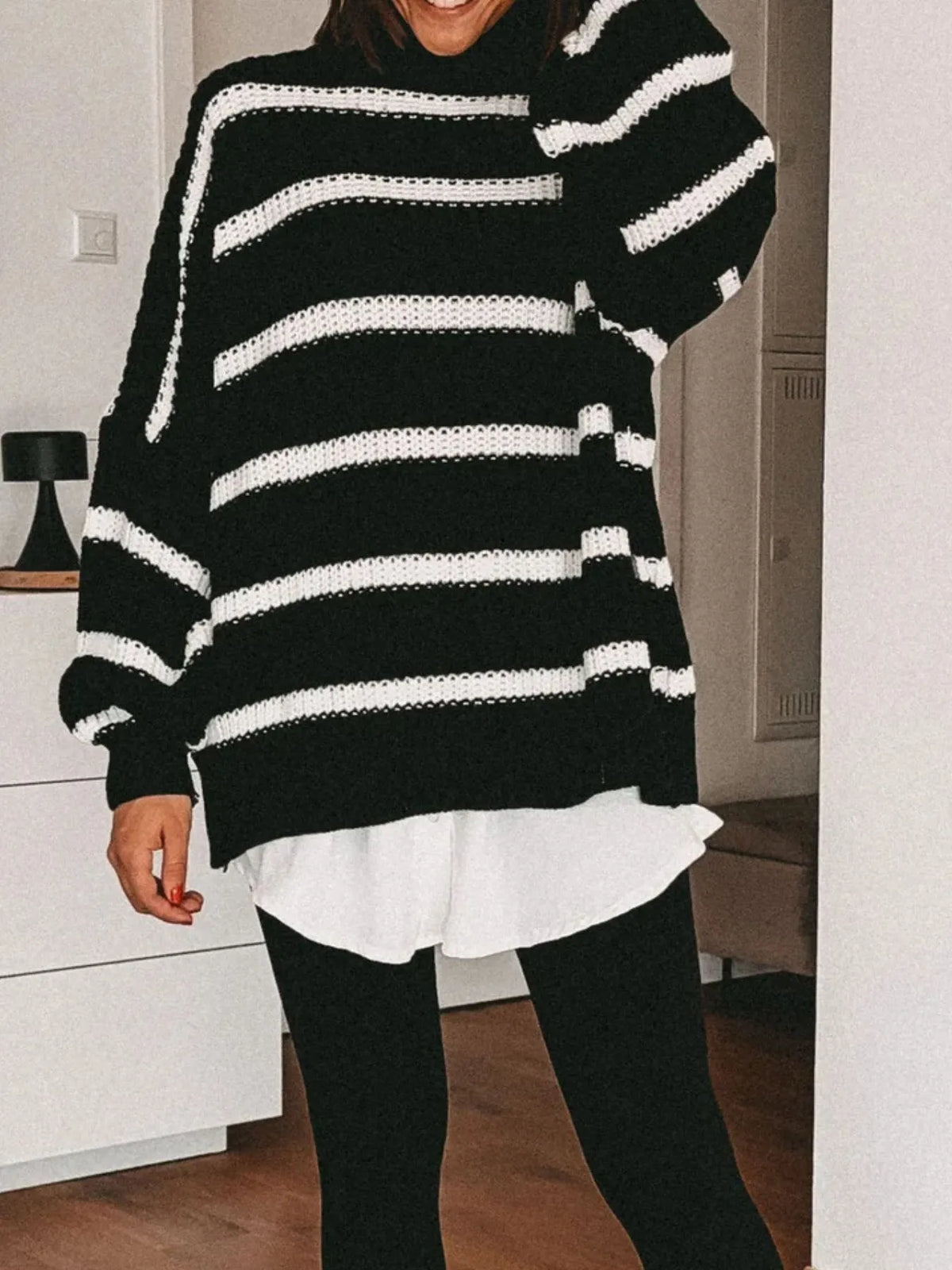 Striped turtleneck sweater flat lay