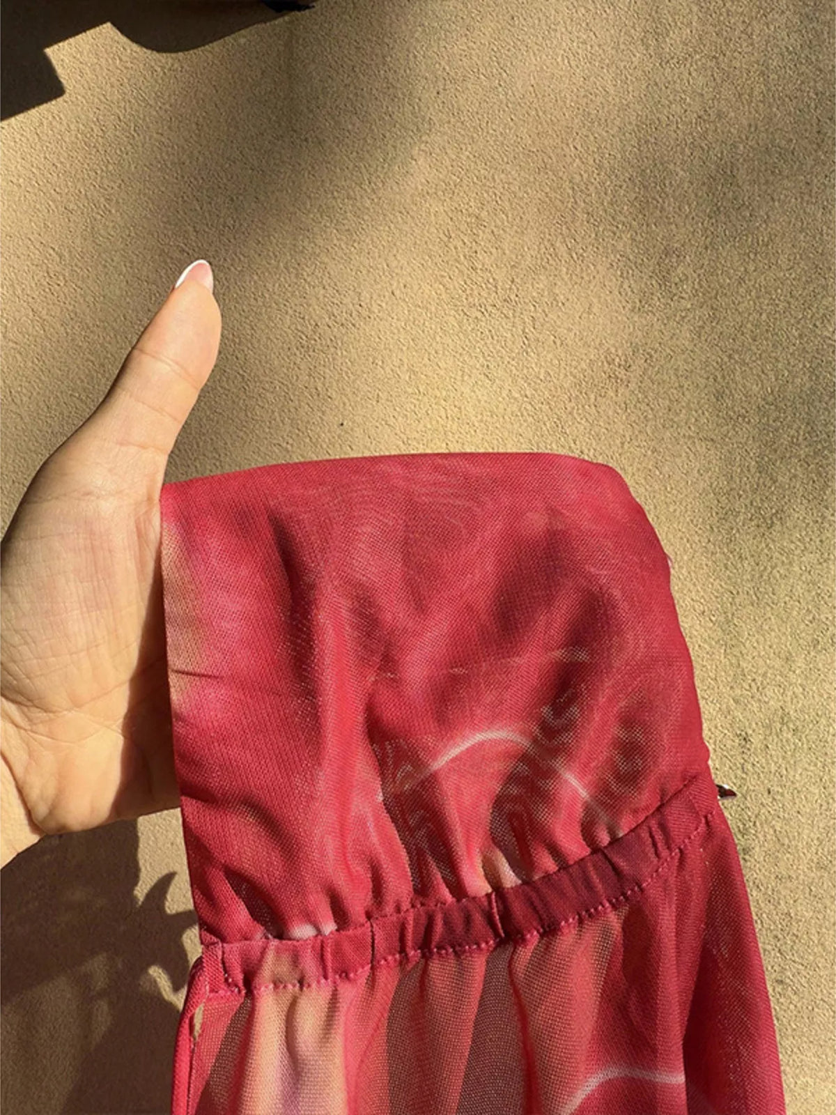 Pink cami top styled for an evening out on a model