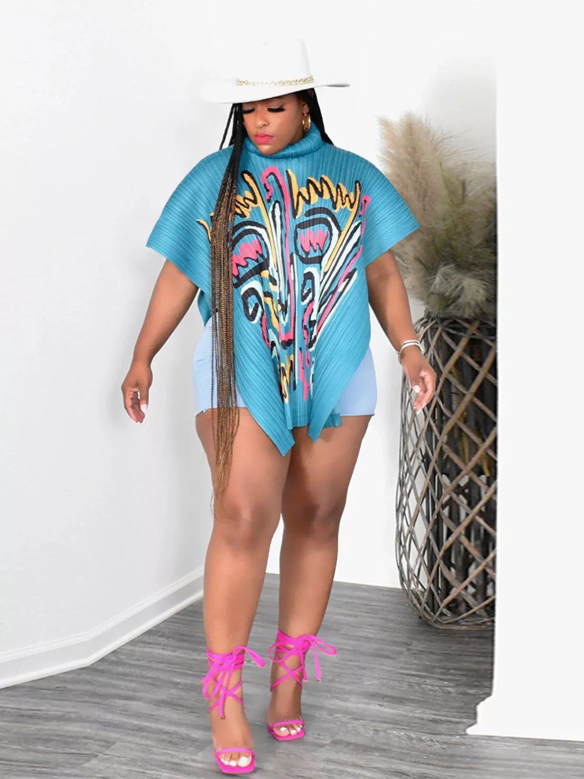 Light blue abstract print turtleneck cape top front view