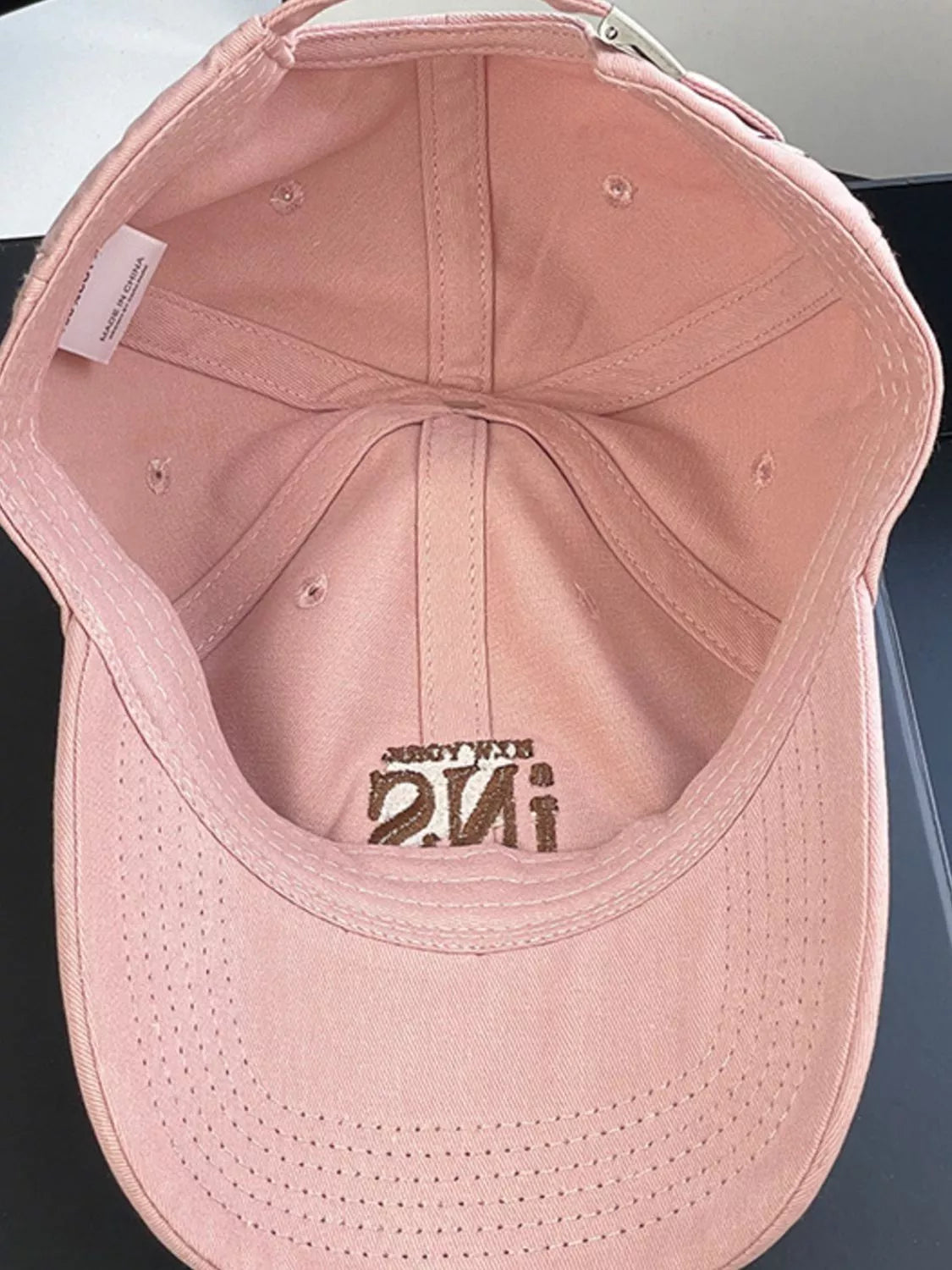 Embroidery detail on the cotton baseball cap