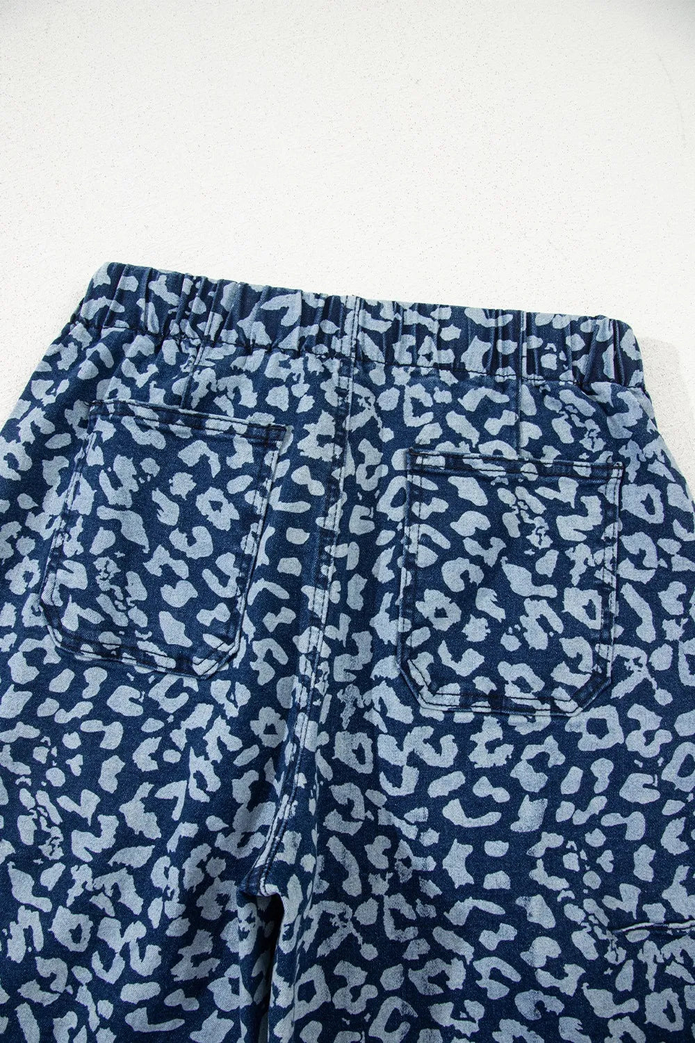 Pocket detail on printed wide leg jeans