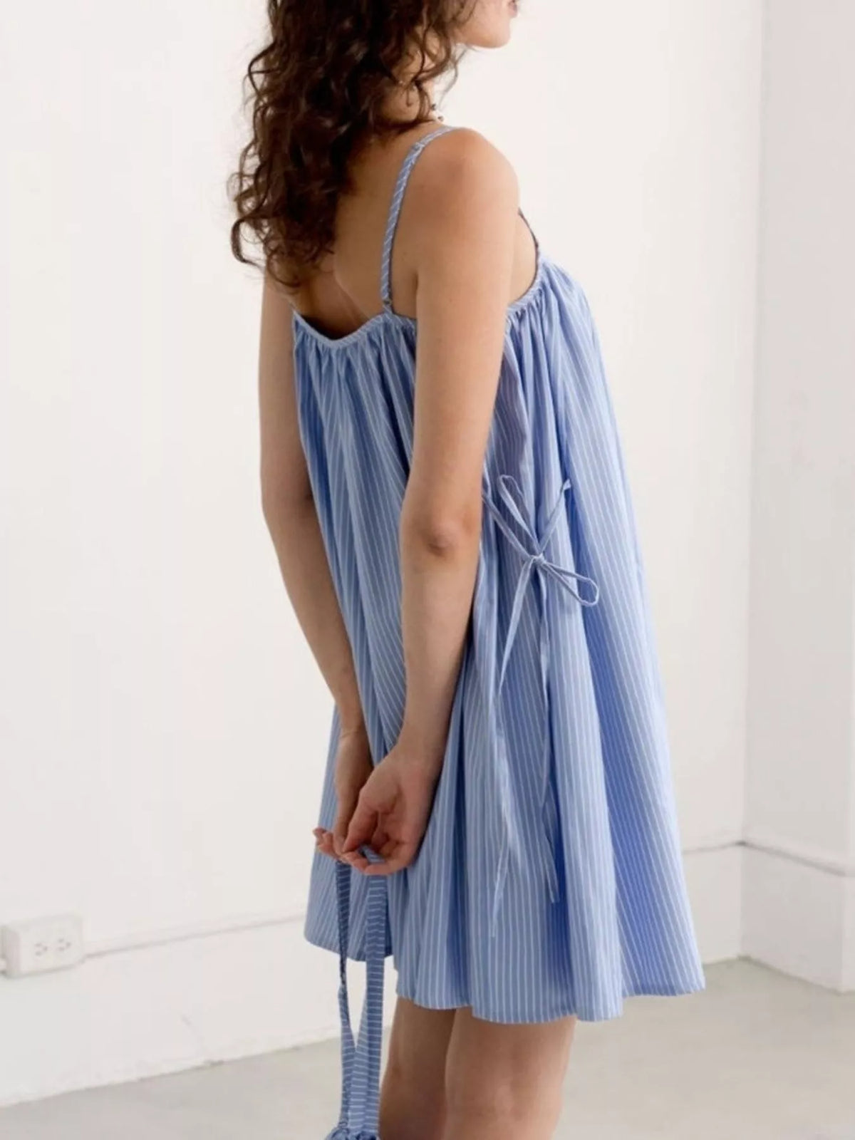 Polka dot mini dress shown in beige