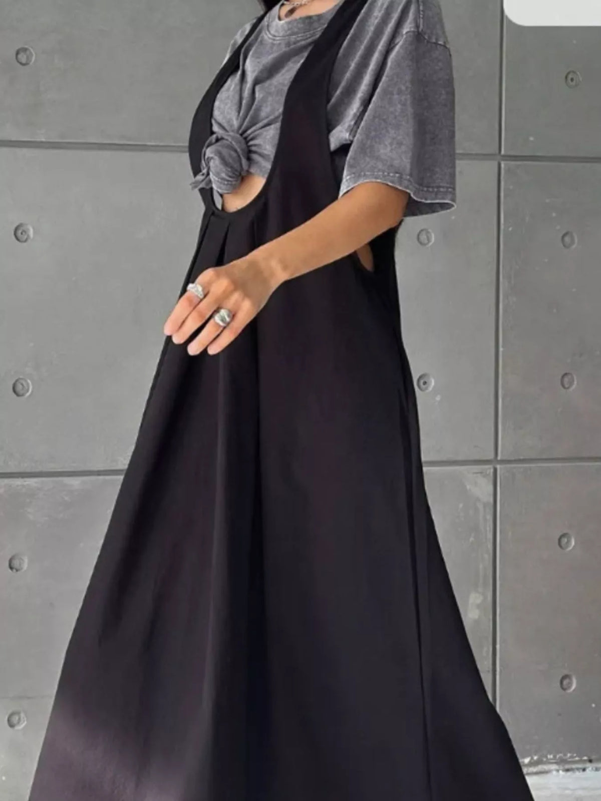 Black pleated overall dress bib and strap detail