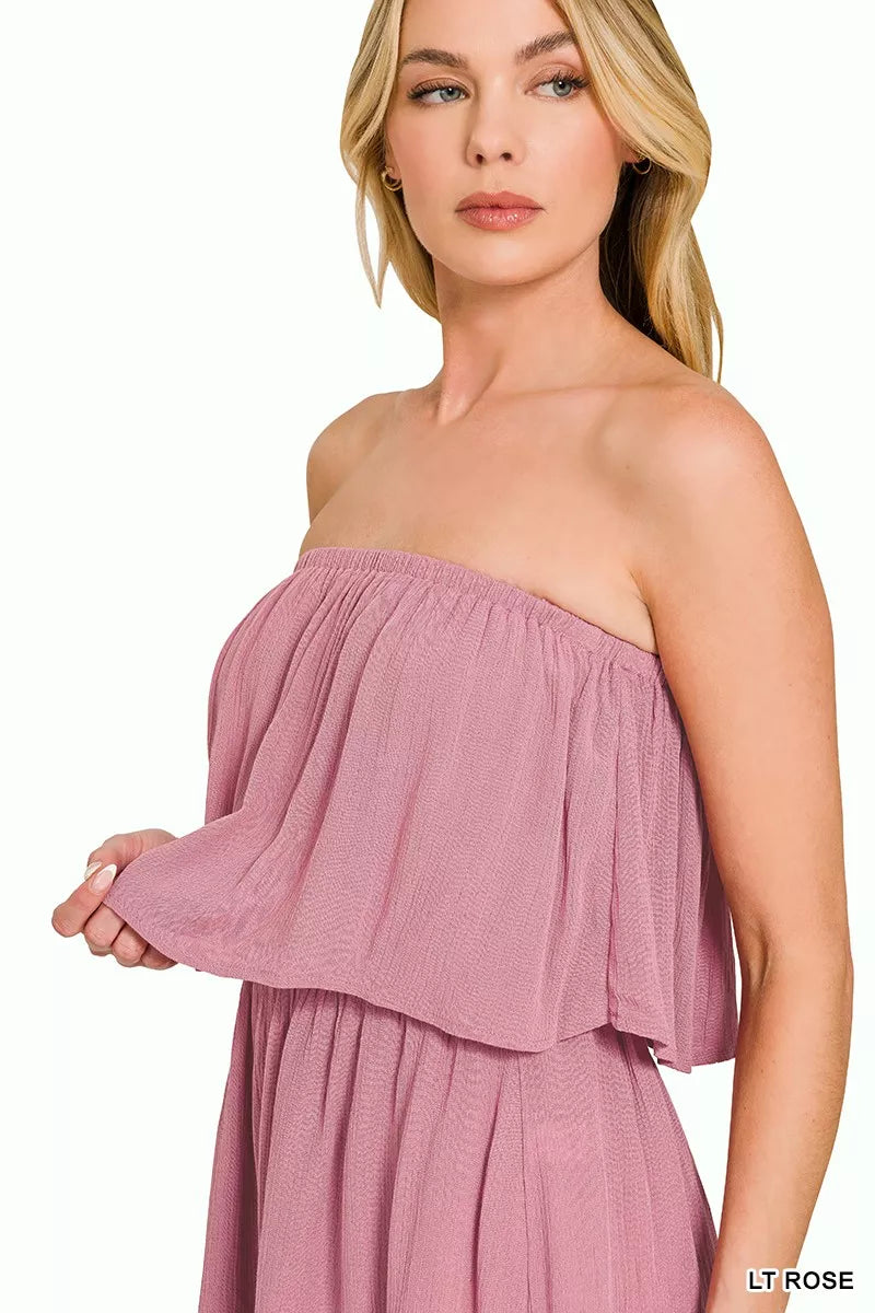 Full length styling view of the woven crinkle strapless romper