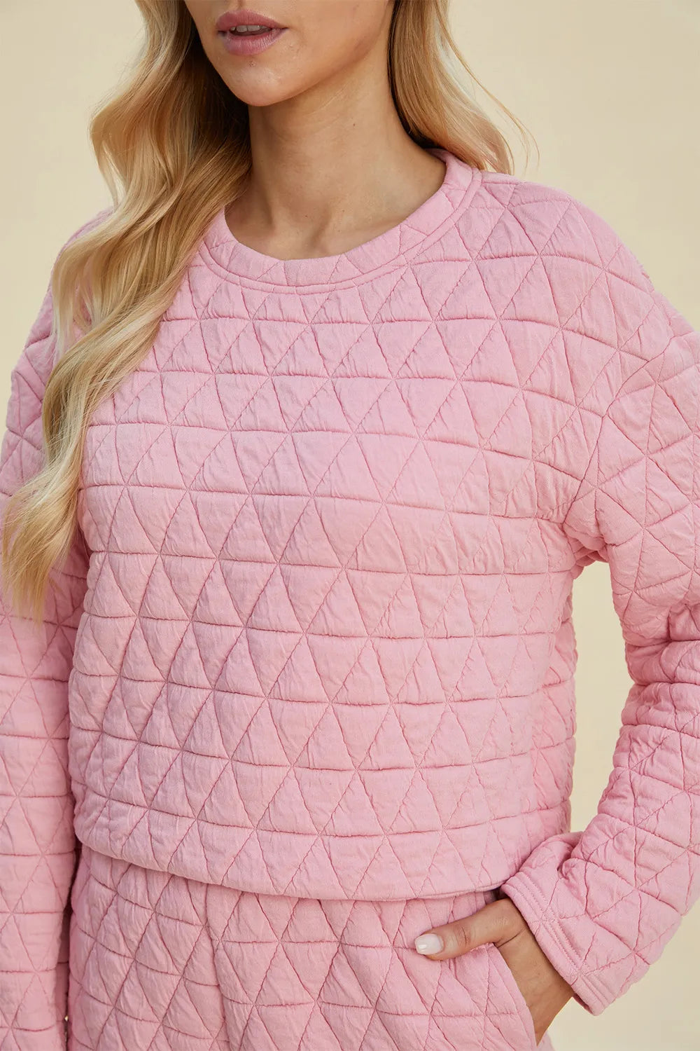 Detail of round neckline on textured top