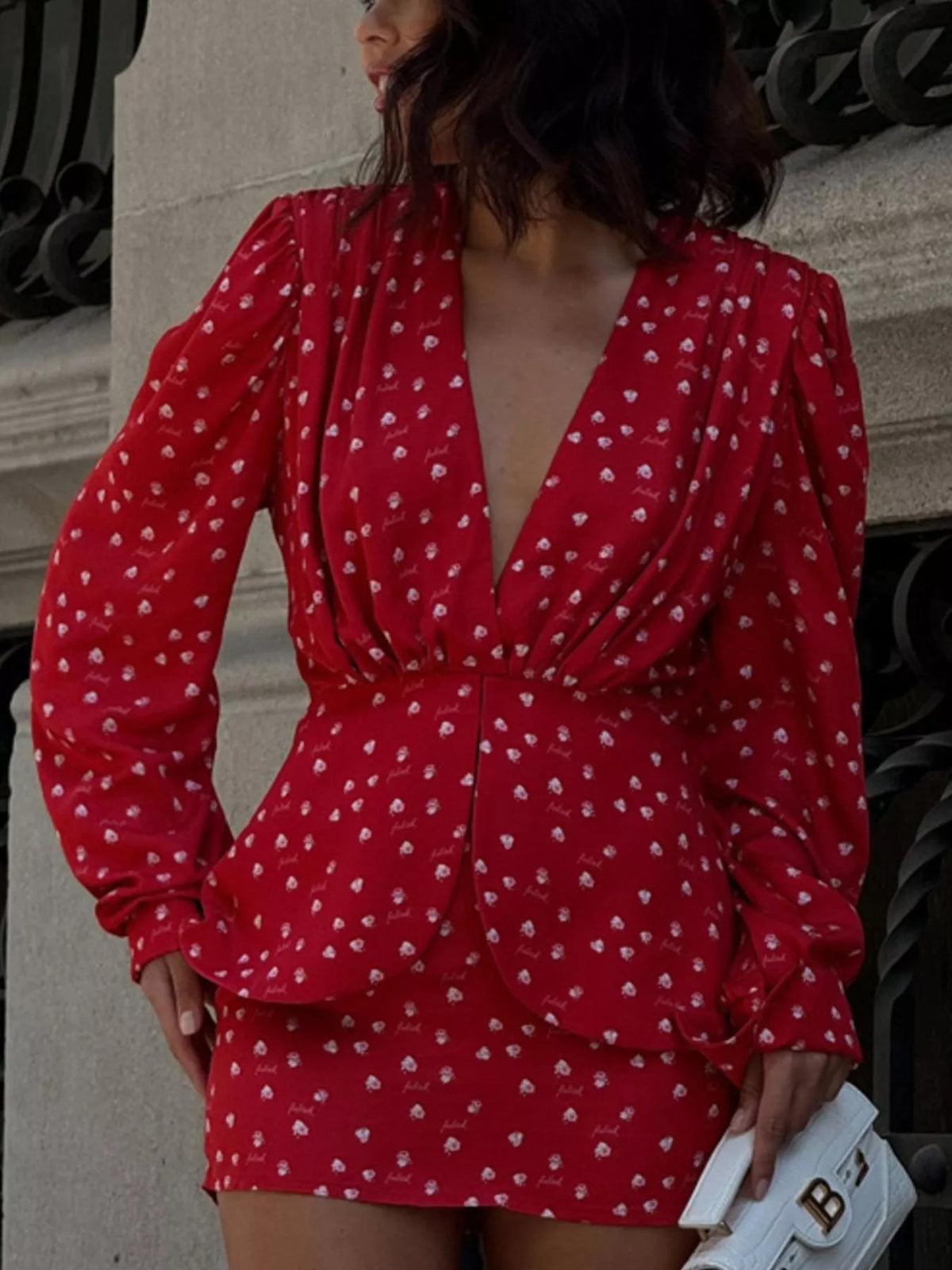 Scarlet polka dot dress styled on model, side angle