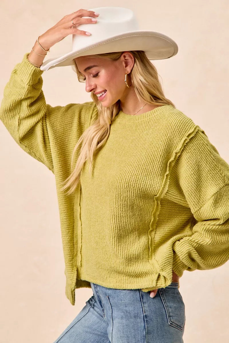 Boucle knit sweater uneven hem detail in lime green