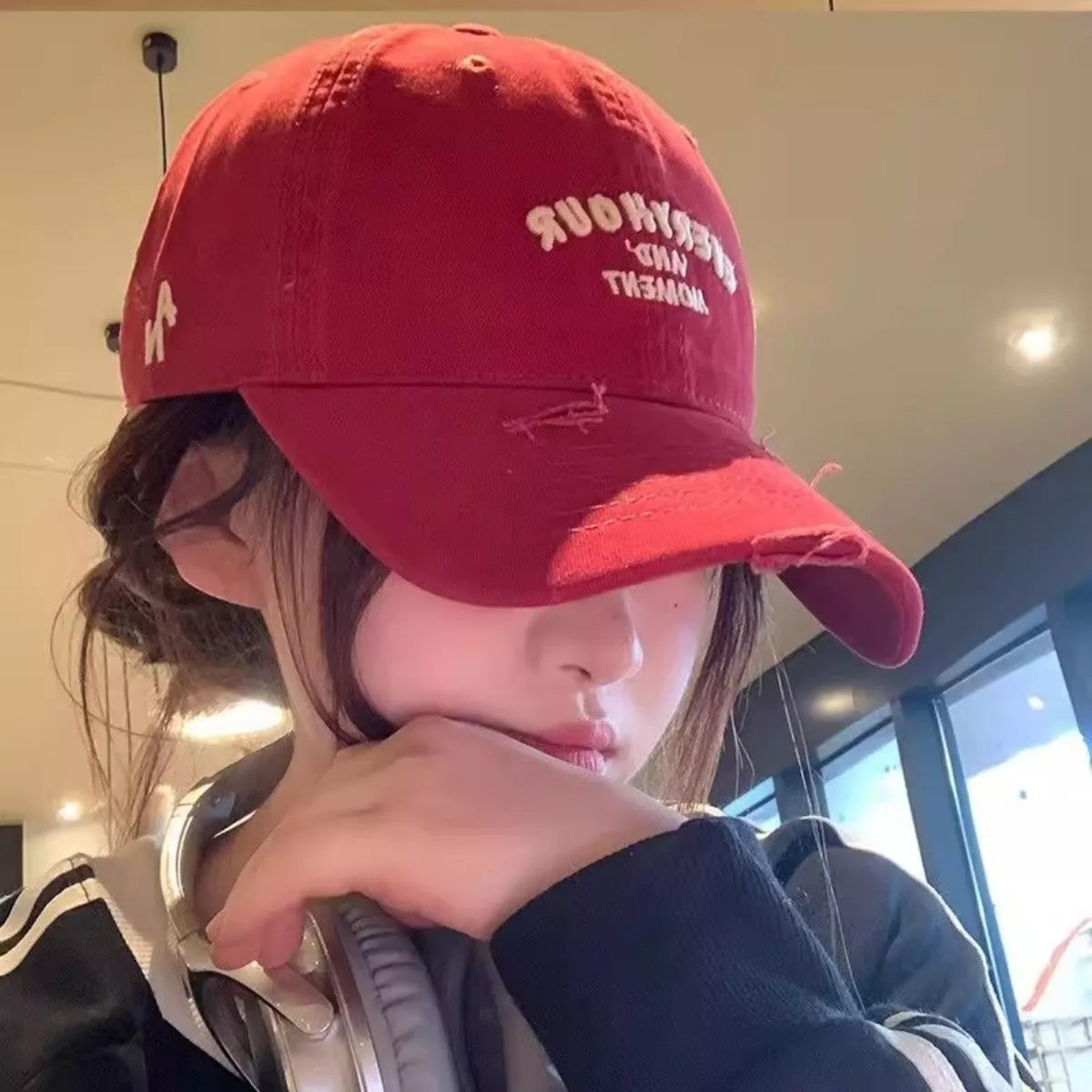 Distressed cotton cap shown from the side