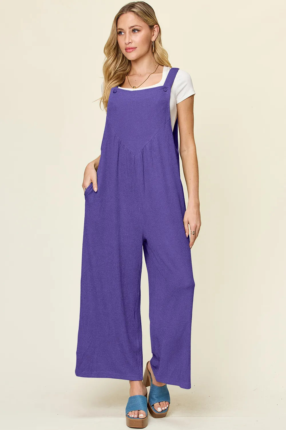 Sleeveless overall styled with a tee
