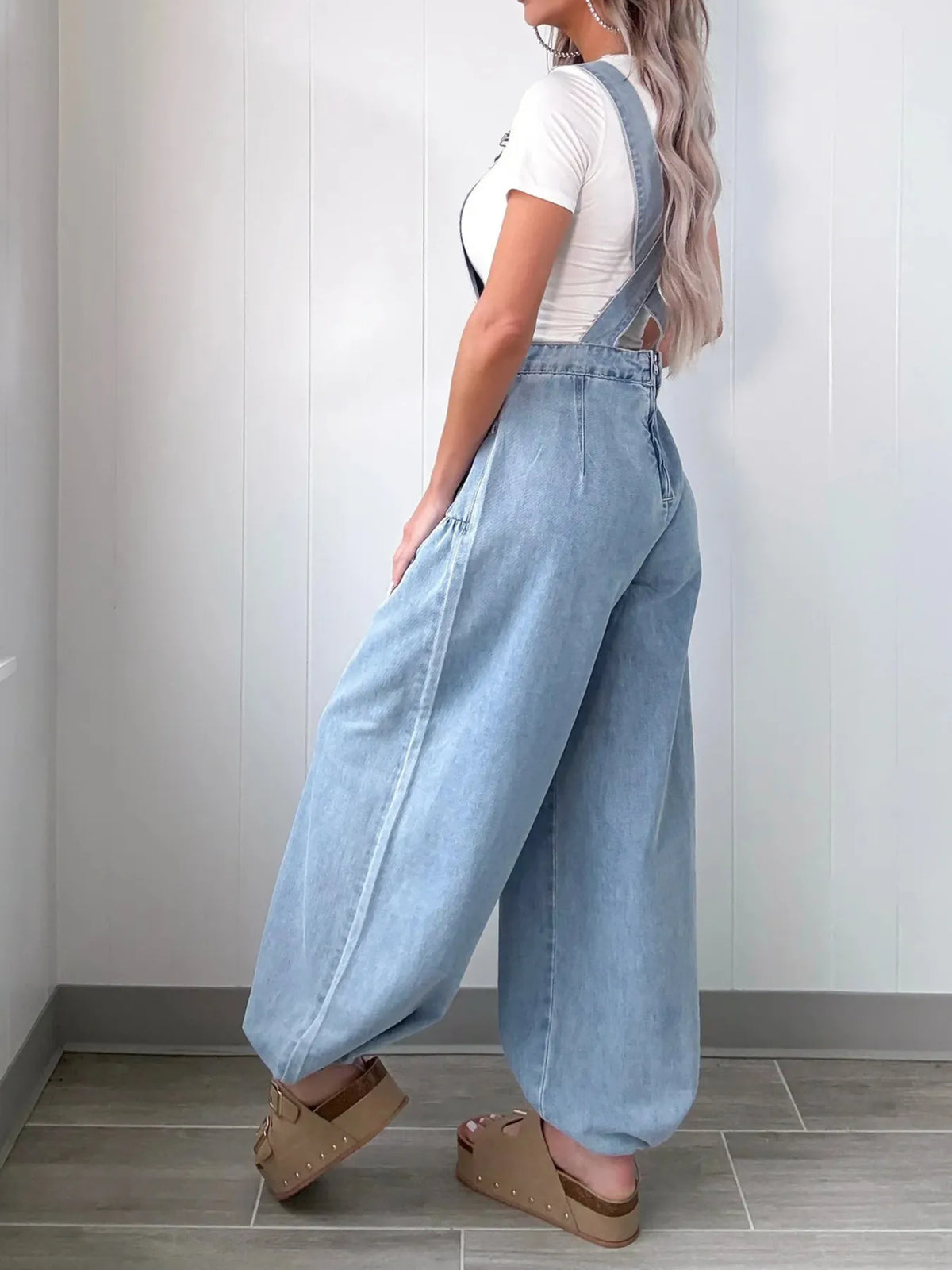 Light blue overalls side button detail