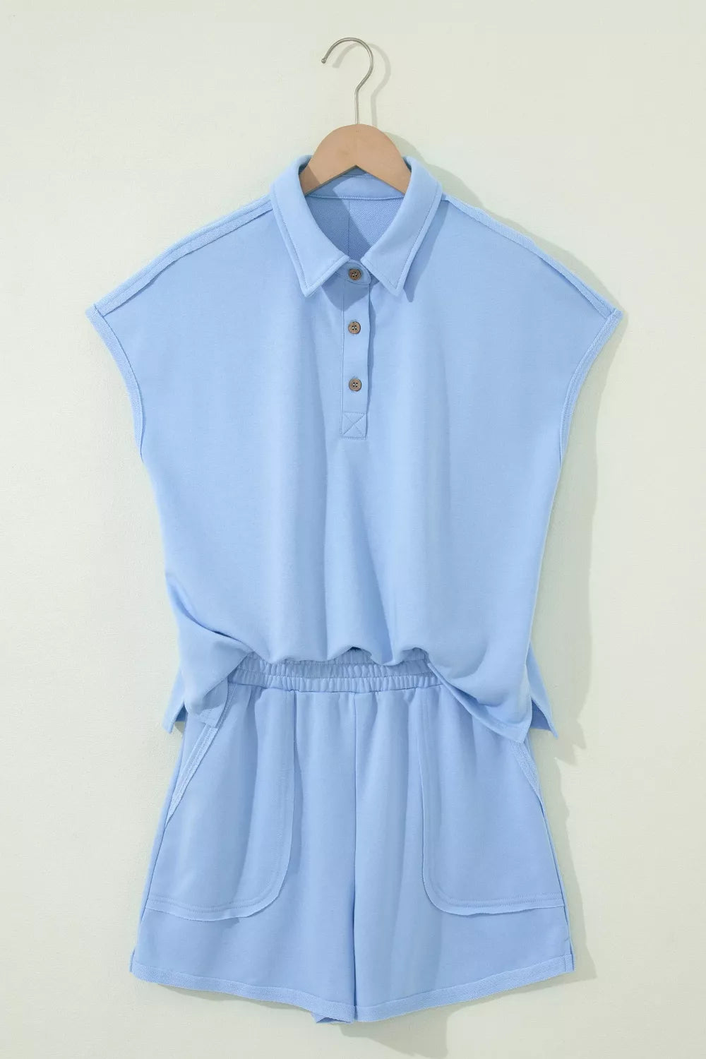 Light blue two piece polo top and shorts side view