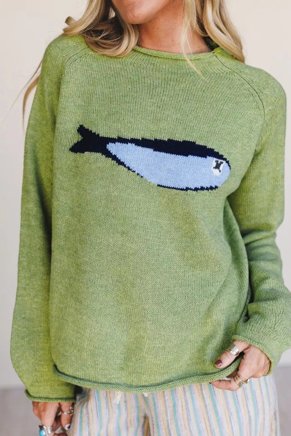 Fish graphic detail on sage sweater