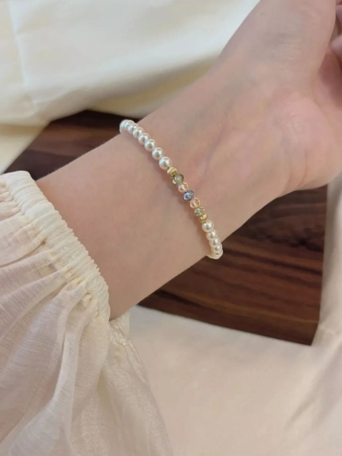Gold plated pearl bracelet on wrist view