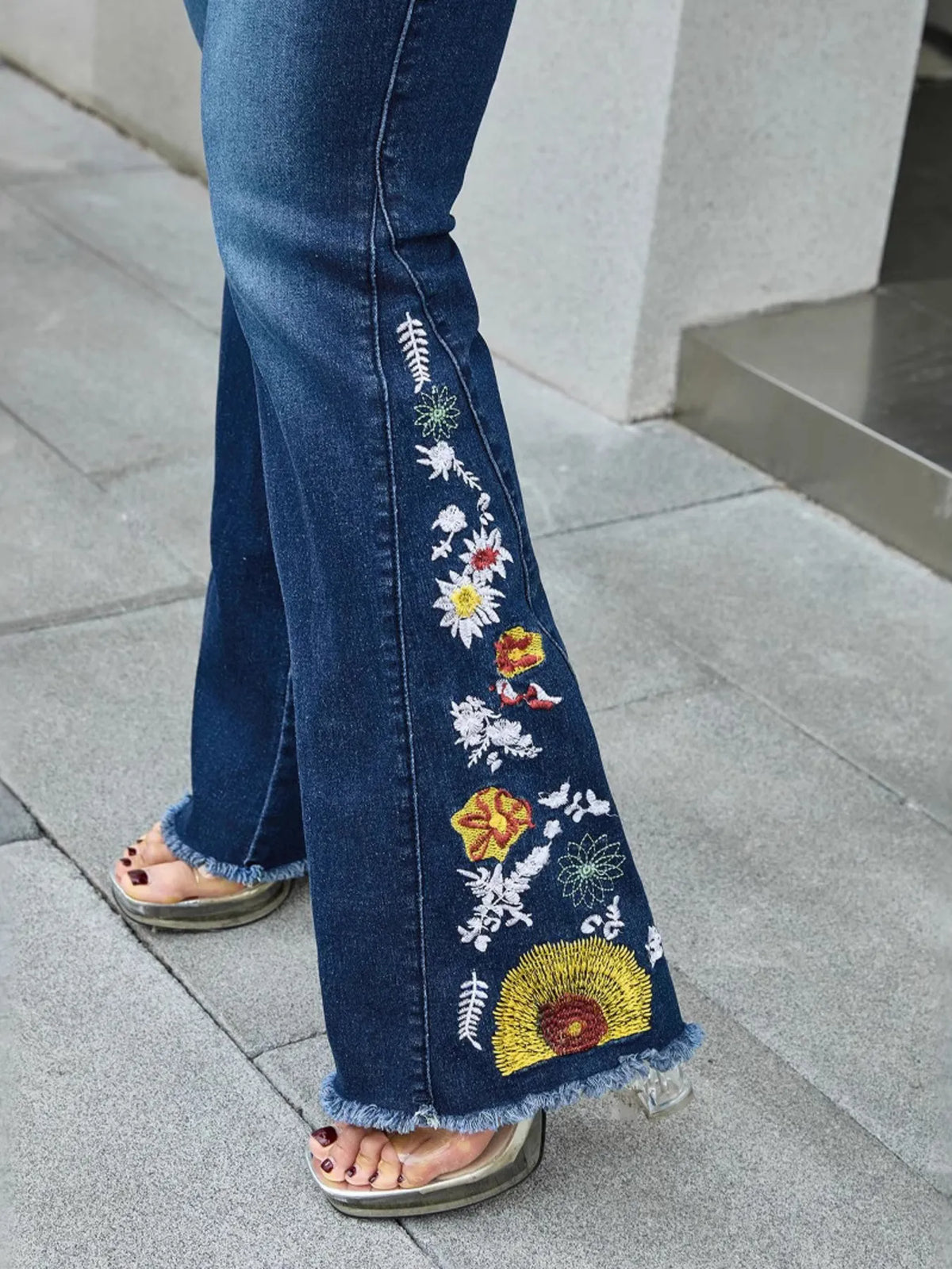 Back view of dark blue embroidered denim