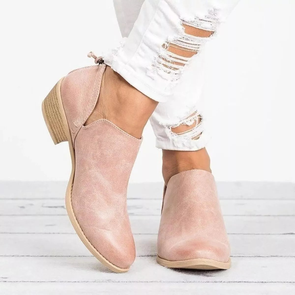 Point toe low heel boots styled with denim