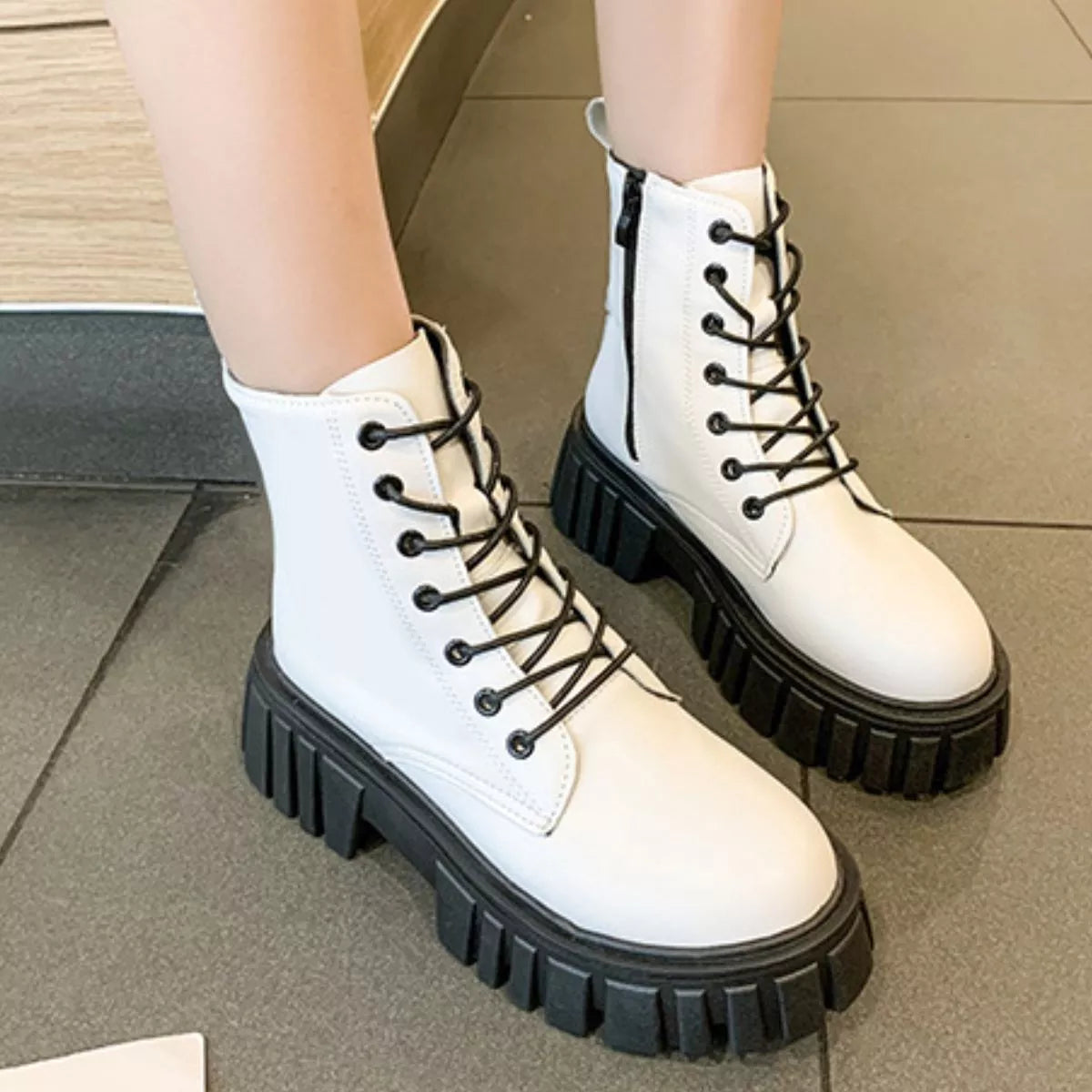Round toe lace up chunky boots angled three quarter view