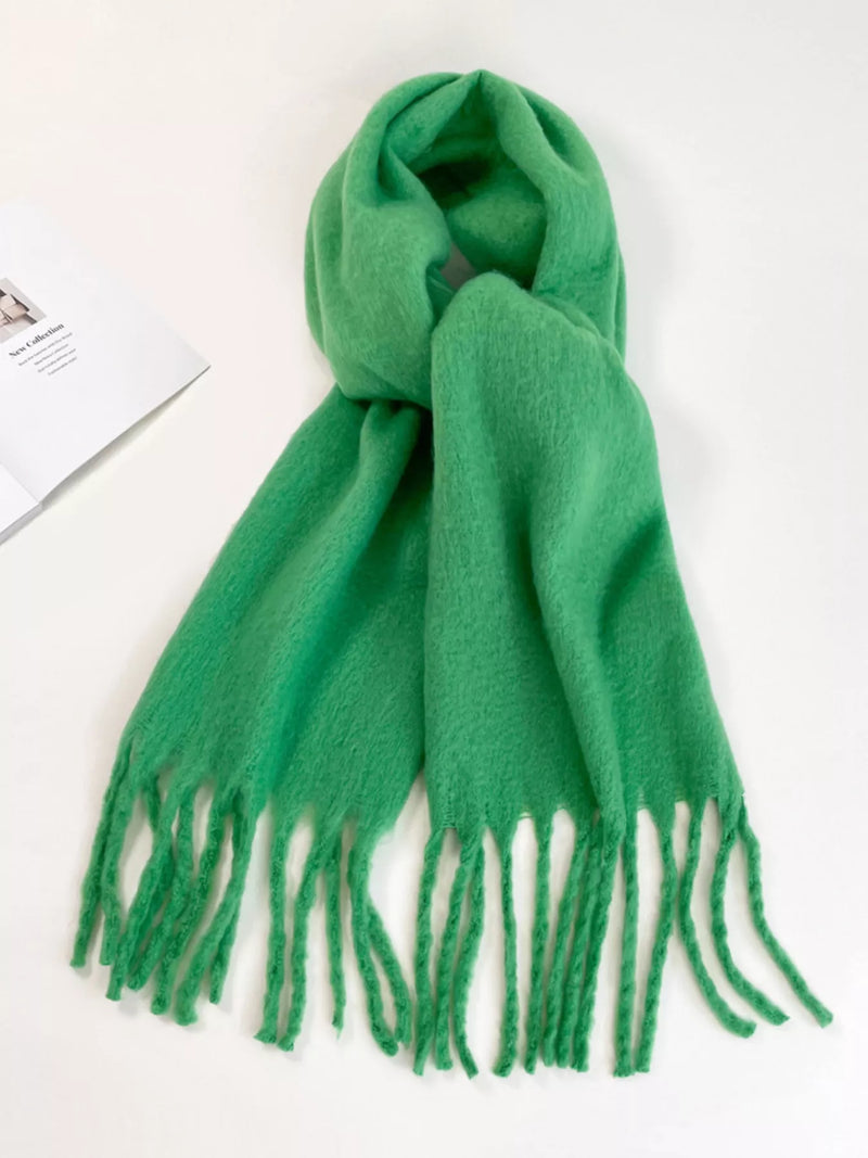 Fringe hem soft winter scarf draped over the shoulders