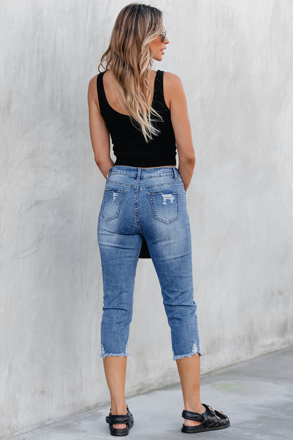 Sky blue cropped skinny jeans full length view
