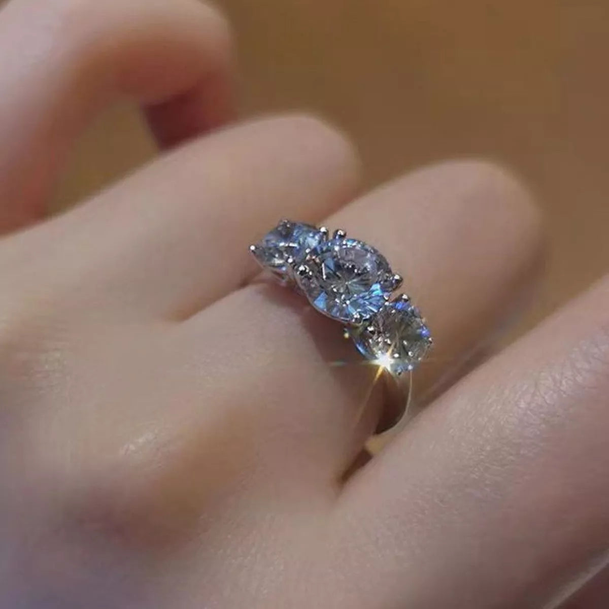 Close view of the 4 carat moissanite stone in its silver setting