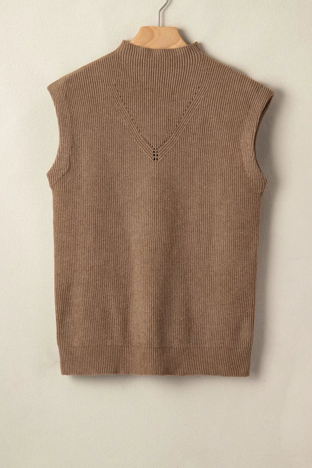 Sleeveless taupe vest styled with leggings